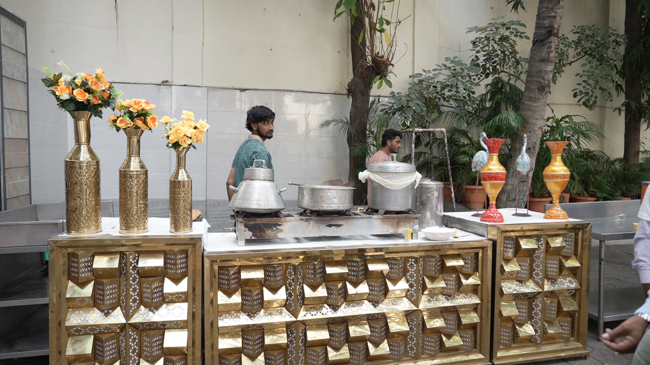 Brass-fronted chai and snack counter at the 2024 expo